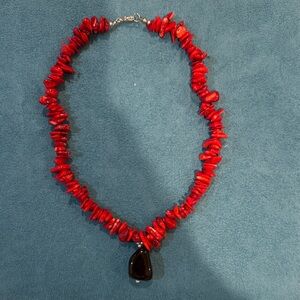 Red coral necklace with large onyx pendant